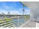 Balcony overlooking waterfront with spiral staircase at 8230 Harborside Cir, Englewood, FL 34224