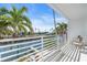 Waterfront balcony with seating and scenic views at 8230 Harborside Cir, Englewood, FL 34224