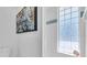 Modern bathroom with a glass block window and decorative art at 8230 Harborside Cir, Englewood, FL 34224