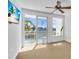 Bedroom with water views and sliding glass doors at 8230 Harborside Cir, Englewood, FL 34224