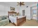 Comfortable bedroom with a ceiling fan and a full-sized bed at 8230 Harborside Cir, Englewood, FL 34224