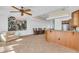 Open concept dining area with wood floors and kitchen view at 8230 Harborside Cir, Englewood, FL 34224