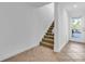 Interior entryway with tiled floors and stairs at 8230 Harborside Cir, Englewood, FL 34224