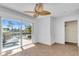 Living room with water view and sliding doors at 8230 Harborside Cir, Englewood, FL 34224