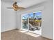 Bright living room with water view and sliding doors at 8230 Harborside Cir, Englewood, FL 34224