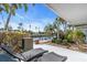 Relaxing patio with lounge chairs and waterfront view at 8230 Harborside Cir, Englewood, FL 34224