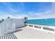 Private rooftop deck with teal roof and city views at 8230 Harborside Cir, Englewood, FL 34224