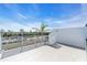 Spacious rooftop deck with water views and railings at 8230 Harborside Cir, Englewood, FL 34224