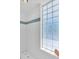 Clean shower with glass block window and grab bar at 8230 Harborside Cir, Englewood, FL 34224