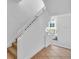 Modern white staircase with window and railing at 8230 Harborside Cir, Englewood, FL 34224