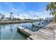 Wooden docks extending into the calm water at 8230 Harborside Cir, Englewood, FL 34224