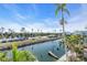 Scenic waterfront view with boats and palm trees at 8230 Harborside Cir, Englewood, FL 34224