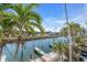 Scenic waterway, palm trees, and private wooden docks at 8230 Harborside Cir, Englewood, FL 34224