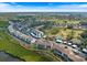 Scenic aerial view of the lovely landscaped community and surrounding green spaces on a sunny day at 854 Bird Bay Way # 190, Venice, FL 34285