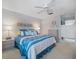 Inviting bedroom with a ceiling fan, a serene color scheme, and comfortable furnishings for relaxation at 854 Bird Bay Way # 190, Venice, FL 34285