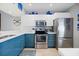 Stylish kitchen with stainless steel appliances, modern cabinetry, and quartz countertops offering modern convenience at 854 Bird Bay Way # 190, Venice, FL 34285