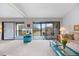 Inviting living room with access to a screened lanai, offering seamless indoor-outdoor living with comfortable seating at 854 Bird Bay Way # 190, Venice, FL 34285