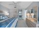 Serene main bedroom with a full bed, ceiling fan, and ensuite bath access with spacious closet space at 854 Bird Bay Way # 190, Venice, FL 34285