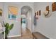 Open entryway with a view into the living room and hallway at 8634 Palmer Park Cir, Sarasota, FL 34238