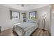 Cozy bedroom featuring a full-size bed and ample natural light at 873 Clematis Rd, Venice, FL 34293