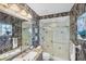 Elegant bathroom with patterned wallpaper and a walk-in shower at 874 Macaw Cir, Venice, FL 34285