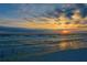 Beautiful sunset view on the beach with blue and orange skies and gentle waves at 8817 Conch Ave, Placida, FL 33946