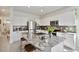 Kitchen island featuring granite countertops and seating at 8955 Milestone Dr, Sarasota, FL 34238