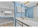 Simple bathroom with vanity and view into bedroom at 927 Capri Isles Blvd # 7, Venice, FL 34292