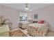 Guest bedroom with twin beds and seashell bedding at 927 Capri Isles Blvd # 7, Venice, FL 34292