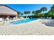 Refreshing community pool with plenty of lounge chairs at 927 Capri Isles Blvd # 7, Venice, FL 34292