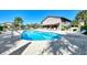 Relax by the inviting kidney-shaped community pool at 927 Capri Isles Blvd # 7, Venice, FL 34292
