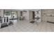 Community room with kitchenette and seating area at 927 Capri Isles Blvd # 7, Venice, FL 34292