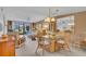 Bright dining area with wicker chairs and glass top table at 927 Capri Isles Blvd # 7, Venice, FL 34292