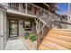Condo entry with wooden stairs and well-maintained landscaping at 927 Capri Isles Blvd # 7, Venice, FL 34292