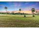 Peaceful sunset view of the golf course at 927 Capri Isles Blvd # 7, Venice, FL 34292