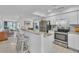 Granite countertop kitchen with stainless steel appliances at 927 Capri Isles Blvd # 7, Venice, FL 34292