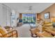 Bright living room with patio access and comfortable seating at 927 Capri Isles Blvd # 7, Venice, FL 34292