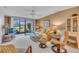 Living room features sliding glass doors to a private patio at 927 Capri Isles Blvd # 7, Venice, FL 34292