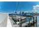 Boats docked at a marina with palm trees at 927 Capri Isles Blvd # 7, Venice, FL 34292