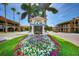 Venice town square entrance with blooming flowers at 927 Capri Isles Blvd # 7, Venice, FL 34292