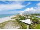 Aerial view of beach, pavilion, and oceanfront buildings at 1000 Tarpon Center Dr # 601, Venice, FL 34285