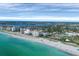 Wide aerial view of coastline, beach, and oceanfront homes at 1000 Tarpon Center Dr # 601, Venice, FL 34285