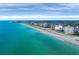 Aerial view of beachfront property with turquoise water and upscale buildings at 1000 Tarpon Center Dr # 601, Venice, FL 34285