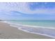 Scenic beach with pier in the distance and calm ocean at 1000 Tarpon Center Dr # 601, Venice, FL 34285