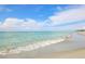 Serene beach with gentle waves lapping the shore at 1000 Tarpon Center Dr # 601, Venice, FL 34285