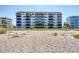 Building exterior view with beach access at 1000 Tarpon Center Dr # 601, Venice, FL 34285