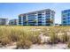 Building exterior view next to beach at 1000 Tarpon Center Dr # 601, Venice, FL 34285