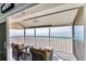 Spacious balcony with ocean view, featuring comfortable seating at 1000 Tarpon Center Dr # 601, Venice, FL 34285