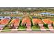 Aerial view showcasing a single-story home in a community setting near a lake at 10117 Colubrina Dr, Venice, FL 34293