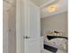 Bedroom with a door leading to a Primary bathroom at 10117 Colubrina Dr, Venice, FL 34293